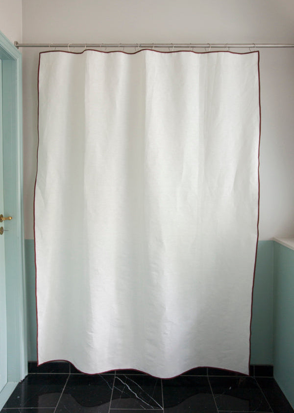 Winther Wackerhausen Clean shower curtain in off-white with Deep Reddish Brown trim, shown as a full-length packshot on a shower rod.