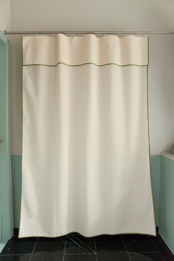 Winther Wackerhausen Contour shower curtain in ivory with green trim, shown in full hanging view.